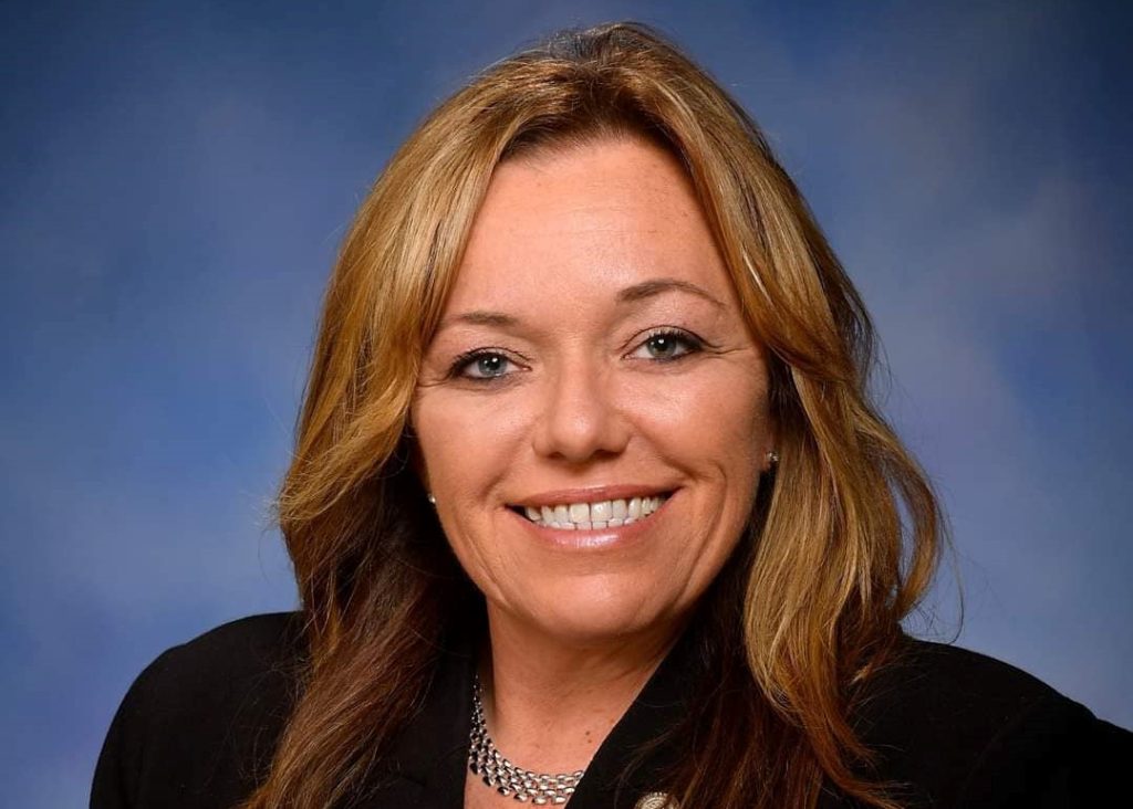 Official portrait of Michigan state Rep. Jamie Thompson smiling