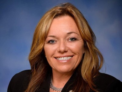 Official portrait of Michigan state Rep. Jamie Thompson smiling
