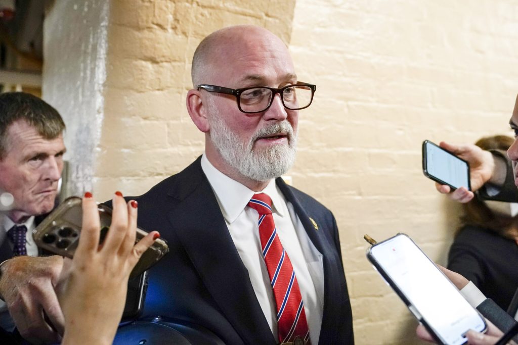 U.S. Rep. Derrick Van Orden speaks to reporters while arriving for a Republican caucus meeting at the U.S. Capitol.