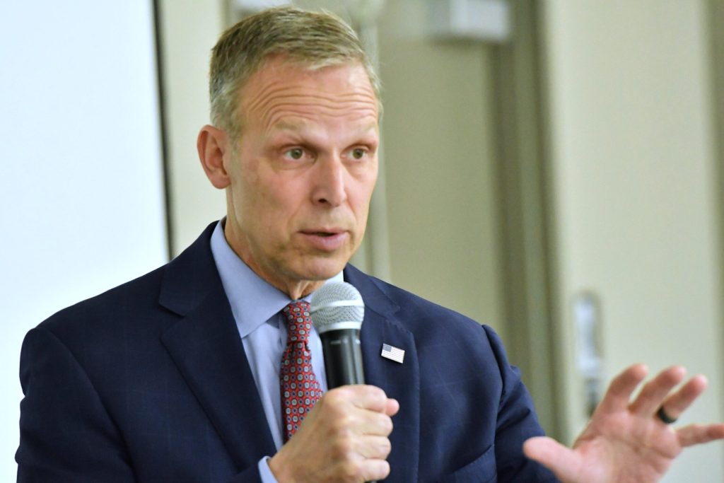 U.S. Rep. Scott Perry speaks into a microphone.