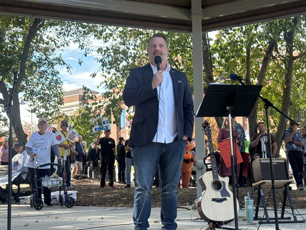 Justin Douglas, a pastor and Dauphin County Commissioner who is running in the Democratic primary to unseat Rep. Scott Perry in Congress, is the first speaker at the Hershey rally. (Photo by Ian Karbal/Capital-Star)