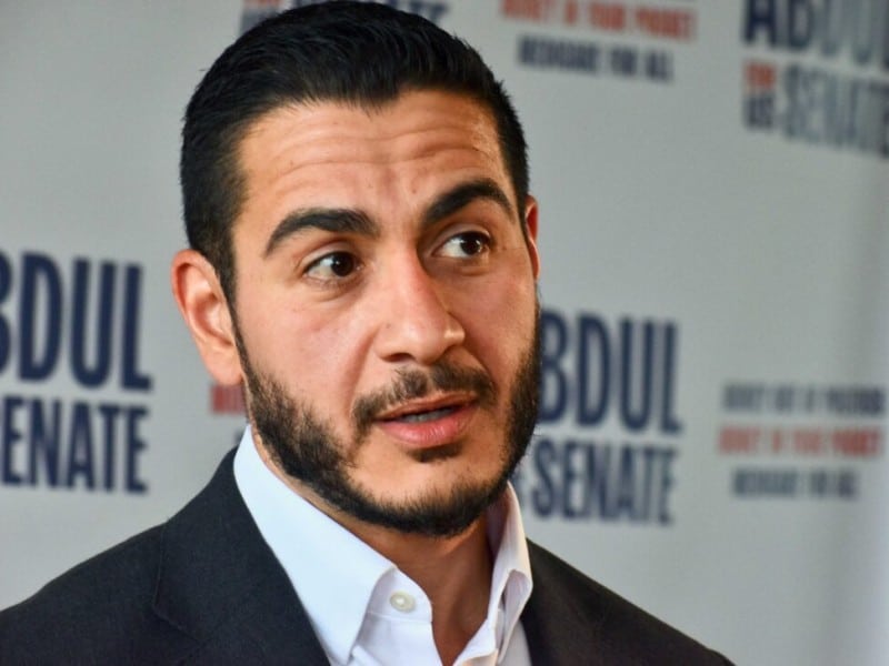 A closeup photo of Michigan U.S. Senate candidate Abdul El-Sayed, wearing a dark suit and white shirt.