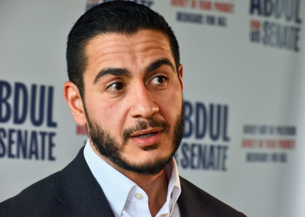 A closeup photo of Michigan U.S. Senate candidate Abdul El-Sayed, wearing a dark suit and white shirt.