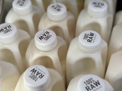 Bottles of raw milk are displayed for sale at a store in Temecula, Calif.