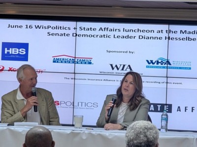 Wisconsin state Senator Dianne Hesselbein sits at a panel table next to WisPolitics President Jeff Mayers.