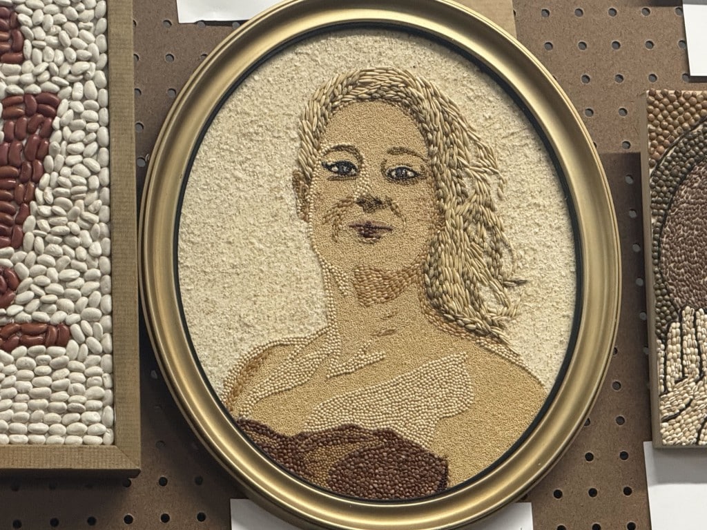 Oval seed art portrait of Renee Good.