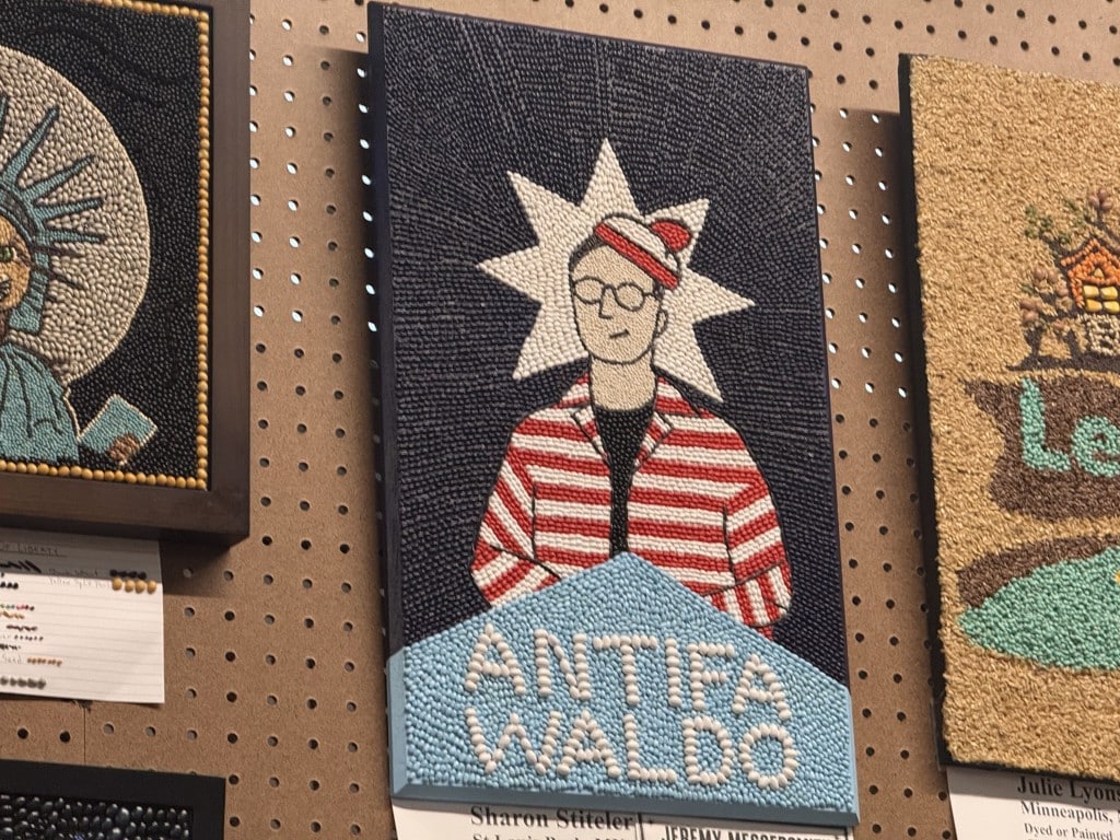Seed art of the character Waldo in a red-and-white striped outfit with text "ANTIFA WALDO."