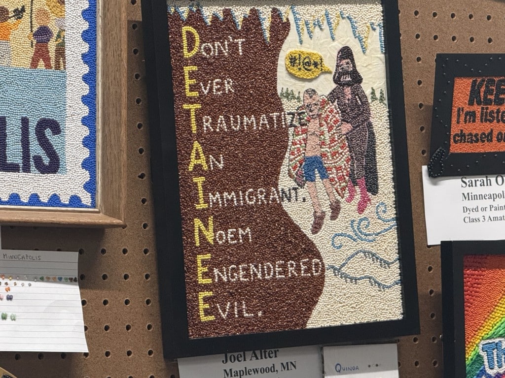 Seed art acrostic spelling DETAINEE: "Don't Ever Traumatize An Immigrant. Noem Engendered Evil."