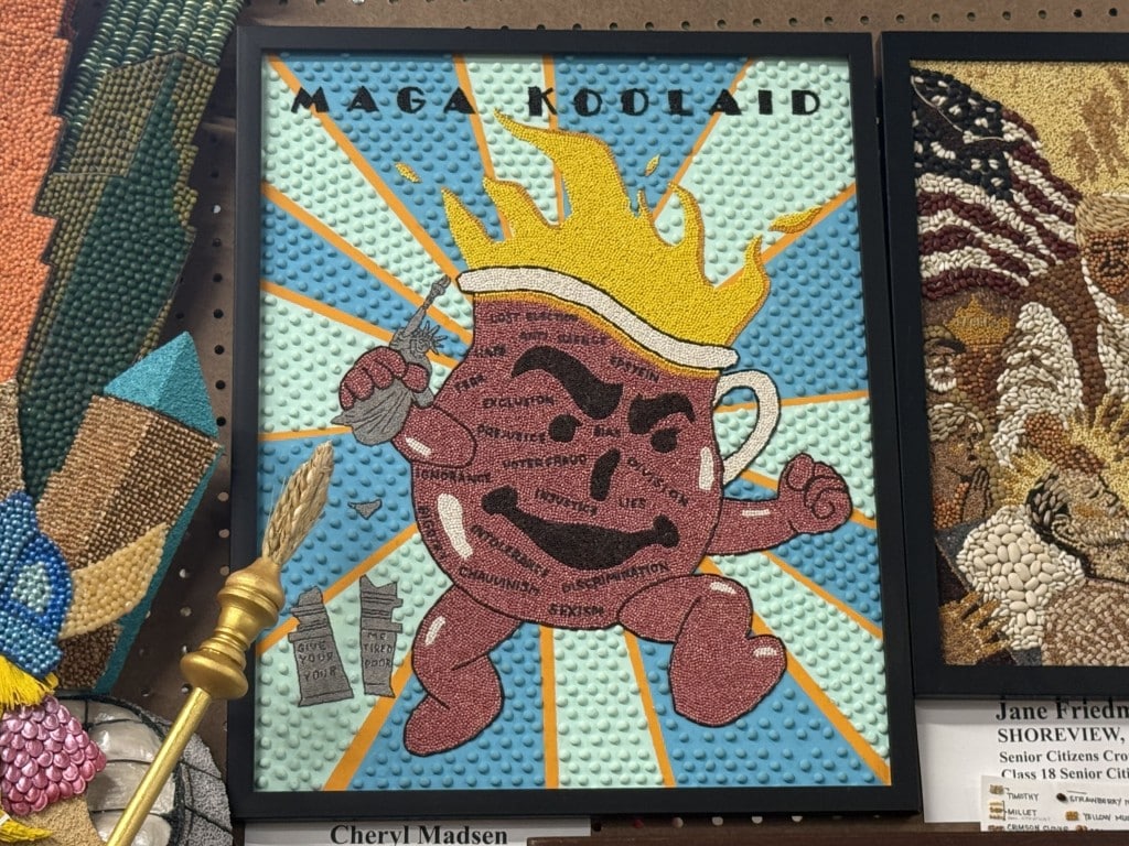 Seed art depicting the Kool-Aid Man covered in political terms under the heading "MAGA KOOL-AID."
