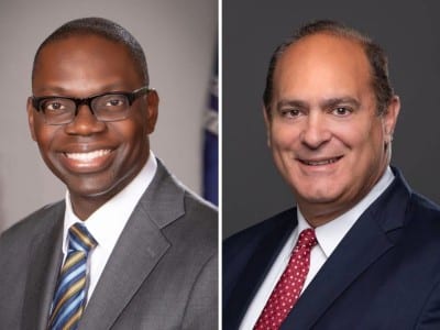 On the left, official portrait of Garlin Gilchrist II in a suit, smiling, with American and Michigan flags behind him. On the right, Headshot of Anthony Forlini, Macomb County clerk and Republican candidate for Michigan secretary of state.
