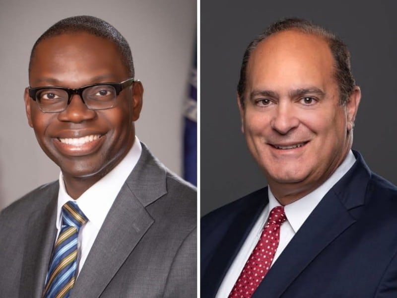 On the left, official portrait of Garlin Gilchrist II in a suit, smiling, with American and Michigan flags behind him. On the right, Headshot of Anthony Forlini, Macomb County clerk and Republican candidate for Michigan secretary of state.