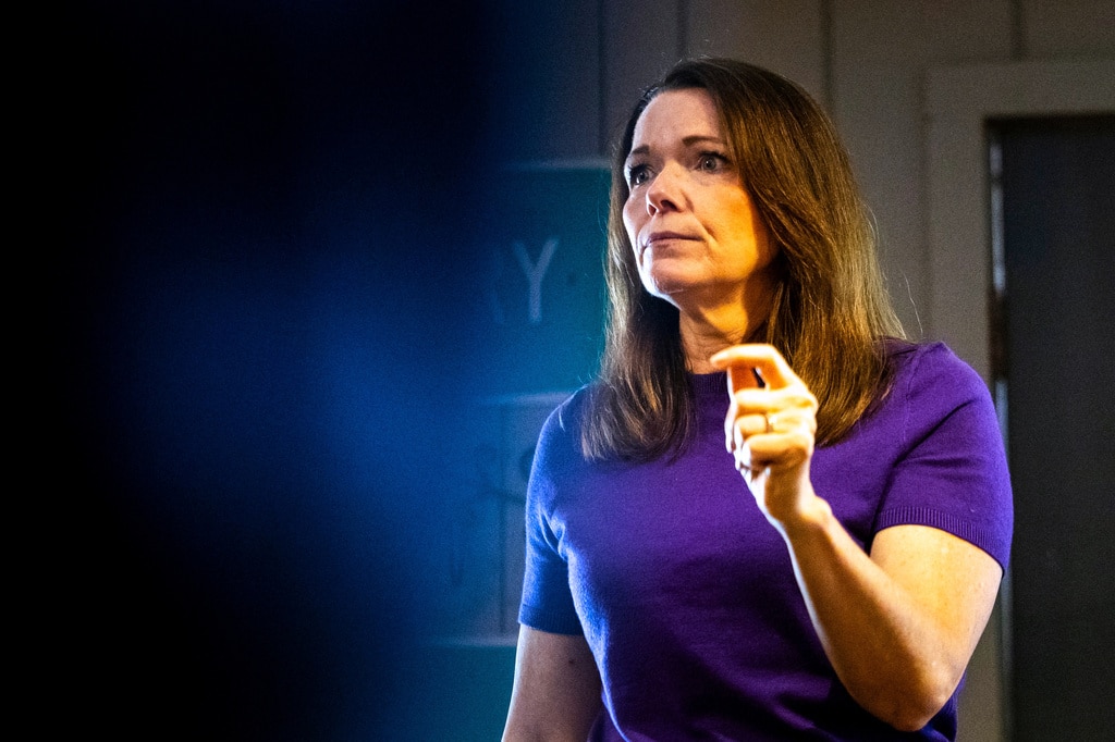 Christina Bohannan gestures with one hand while speaking, looking off to the side.